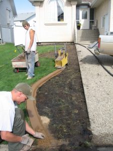 Karl and Brian at work trowelling the curb